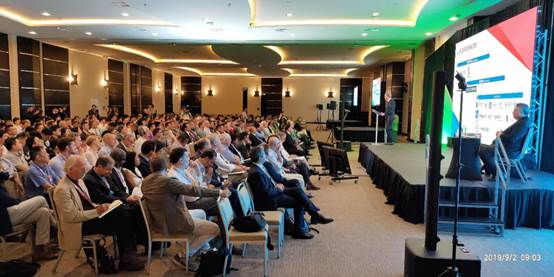 A group of people in a room
Description automatically generated